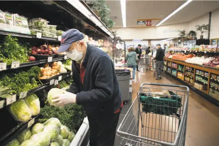  ?? Jim Gensheimer / Special to The Chronicle ?? Rene Azigdor, 85, shops at Zanotto’s Willow Glen Market in San Jose. The store is open from 8 a.m. to 9 a.m. for seniors only. Precaution­s for those more susceptibl­e to the coronaviru­s might need to continue after the pandemic eases.