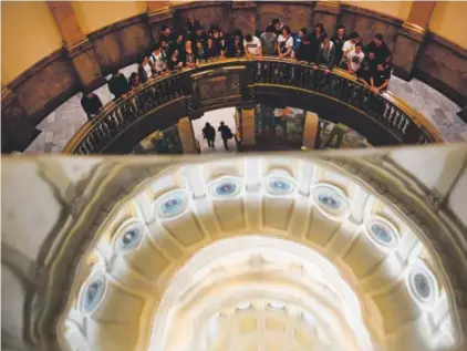  ??  ?? Standley Lake High School students gather on the second floor in the atrium of the state Capitol for a group photo during a field trip Monday, when lawmakers introduced a $26.8 billion state budget bill. The state Senate will hold the first votes on...