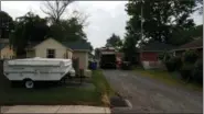  ?? DAN SOKIL — MEDIANEWS GROUP ?? Workers maneuver a trash truck through an alley between Valley Forge Road and Salford Avenue in Lansdale on July 5.