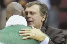  ?? AP FILE PHOTO ?? RELATING: Kevin McHale, then coach of the Rockets, gets a hug from then Celtic Kevin Garnett in 2012 following the death of McHale’s daughter.