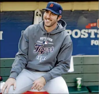  ?? Associated Press ?? Detroit’s Justin Verlander was all smiles here during the American League Championsh­ip Series, but the Tigers went down in a sweeping defeat to the San Francisco Giants in the World Series, and Wednesday, Verlander was beaten by Tampa Bay’s David Price...