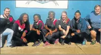  ??  ?? BIG EFFORT: Helping the De Vos Malan Primary School are, from left, Grant Gait-Smith, Langa Nobambela, Ayabonga Mlanjana, Mpembe Bohla, Emma Thomas, Delaine Christian and James Beyl