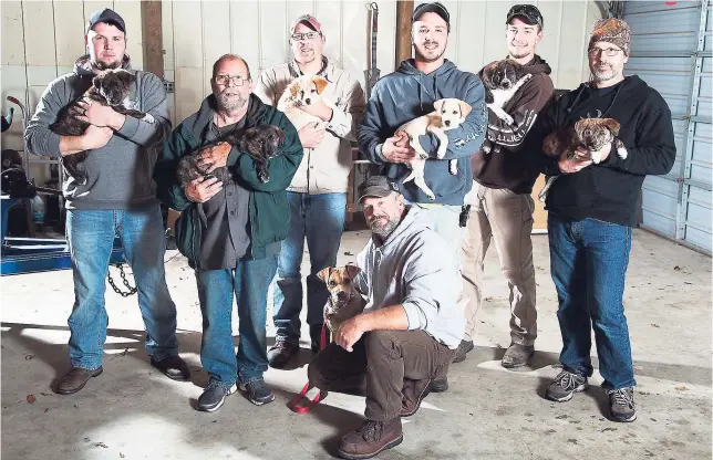  ?? AP ?? In this Wednesday, October 26, 2016 photo (from left) Jake Rowe holding Knox, Joe Gruber holding Bear, Alex Manchester holding Rosie, Doug Craddock with Annie, Mitchel Craddock holding Brimmie, Brent Witters holding Finn, and Dexter Jennings holding...