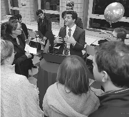  ??  ?? Dr. Brett Beber, plastic and reconstruc­tive surgeon at Women’s College Hospital, surrounded by patients.