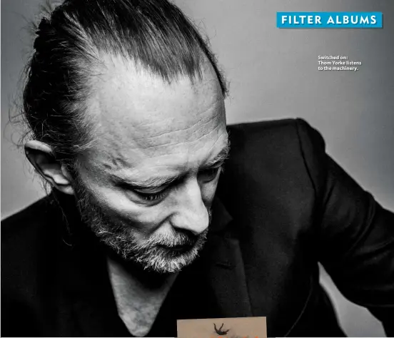  ??  ?? Switched on: Thom Yorke listens to the machinery.