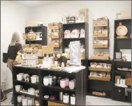  ?? (NWA Democrat-Gazette/Lynn Kutter) ?? A customer shops in one of the rooms at Birch & Basil Gifts in Prairie Grove.