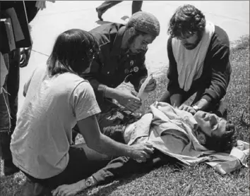  ?? Howard E. Ruffner ?? Fellow Kent State University students aid John Cleary after he was struck by National Guard gunfire on May 4, 1970.