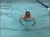  ??  ?? Sara Pierce, Oroville YMCA program director, took advantage of the facility’s reopened pool to do some laps Wednesday in Oroville.