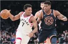 ?? MARY ALTAFFER/THE ASSOCIATED PRESS ?? Toronto Raptors guard Kyle Lowry drives to the basket against New York Knicks guard Frank Ntilikina during the first half in New York on Sunday. The Raptors won 132-106.