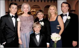  ??  ?? Miles McGeorge, mother of the bride Marie Hurst Gunti, Morgan and Huntley McGeorge (in front) and sister of the bride and matron of honor Susan Gunti McGeorge and her husband, Brian