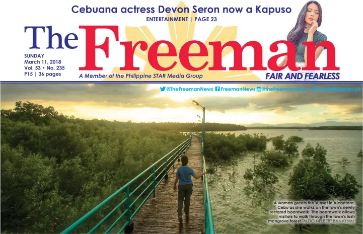  ?? ALDO NELBERT BANAYNAL ?? A woman greets the sunset in Alcantara,
Cebu as she walks on the town's newly restored boardwalk. The boardwalk allows
visitors to walk through the town's lush mangrove forest.