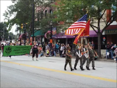  ?? TYLER RIGG — THE NEWS-HERALD ?? Members of the Greater Lake County Young Marines color guard march during the Last Stop Willoughby parade on Aug. 24.