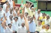  ?? AFP FILE ?? Newly elected members of the Karnataka assembly from the Congress and the JD(S) celebrate after BS Yeddyurapp­a resigned from his post of chief minister in Bengaluru.