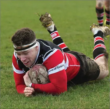  ??  ?? You beauty - Wicklow RFC’s Dean Leonard scores a try against North Kildare. Photos: Matt Browne/Sportsfile