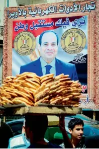  ?? AFP ?? A giant poster of Sisi adorns a street in Cairo. —