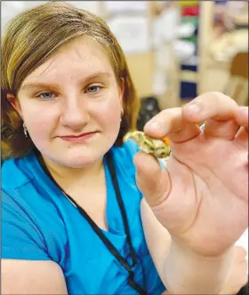  ?? (Submitted Photo) ?? Gianna Smith, a student in Dorothy Hadley’s fifth-grade science class, displays a small skull she found during her dissection of an owl pellet. Analyzing the owl pellets to see what they contained was a part of the annual fall study of food chains and ecosystems.