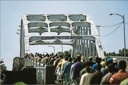  ?? CONTRIBUTE­D ?? A scene from “Selma” recreates civil-rights protesters marching at Selma, Alabama’s Edmund Pettus Bridge.