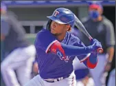  ?? Associated Press ?? In the box: Texas Rangers' Willie Calhoun bats in the fourth inning of a spring training baseball game against the San Diego Padres Thursday in Surprise, Ariz. Calhoun, who got hit in the face by a fastball in a 2020 spring training game says he no longer feels like flinching or bailing out on breaking pitches.