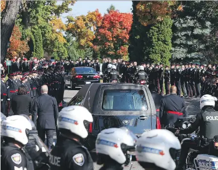  ?? JEAN LEVAC/ OTTAWA CITIZEN ?? The funeral procession for Staff Sgt. Kal Ghadban at Beechwood National Memorial Centre on Thursday.