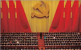  ?? Picture: AP ?? ADVICE: Communist Party delegates applaud as Chinese President Xi Jinping delivers a speech at the opening ceremony. Xi urged a reinvigora­ted Communist Party to take on a more forceful role in society.