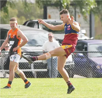  ?? ?? Luke Walker fires through an early goal for Warragul Industrial­s. Walker was later named as one of the Dusties’ best players for the day.
Photograph by AMANDA EMARY.