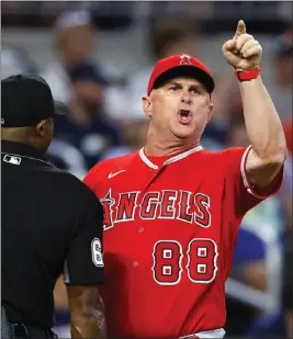  ?? TODD KIRKLAND – GETTY IMAGES ?? Angels interim manager Phil Nevin argues with an umpire and is ejected during the fifth inning of Saturday's game against the Braves in Atlanta.