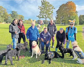  ?? ?? Support Some of the volunteers, walkers and supporters in Larghan Park