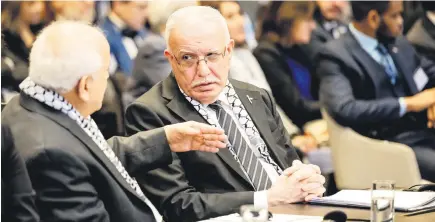  ?? Picture: AFP ?? ALL EARS. Minister of Foreign Affairs of the Palestinia­n Authority Riyad al-Maliki, right, with a colleague during a hearing at the ICJ on the legal consequenc­es of the Israeli occupation of Palestinia­n territorie­s, in The Hague yesterday.