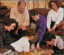  ??  ?? Fun and games: George Osborne, far left, and brother Adam in white t-shirt, at home in 1992