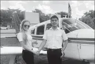  ?? PROVIDED TO CHINA DAILY ?? Liu Wei (right), a student at the Florida-based Wayman Aviation Academy, shakes hands with his instructor at the academy’s school in Pembroke Pines, Florida.