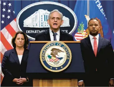  ?? ANNA MONEYMAKER/GETTY ?? Attorney General Merrick Garland, center, announces the appointmen­t of a special counsel Friday.