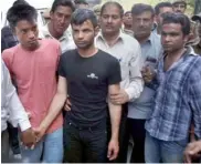  ?? — PTI ?? The victims’ uncle, Amit Singh ( from left), and his friends Shivam Gupta ( 19) and Pankaj Kashyap ( 19) in Delhi police custody on Sunday.