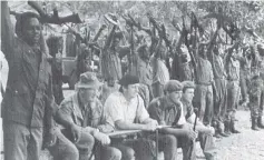  ?? Credit: Dr Miles Tendi ?? The late Major-General Paradzai Zimondi (standing left), whose Chimurenga name was Cde Tonderai Nyika, other freedom fighters, and members of the Commonweal­th monitoring force and the Rhodesian army at the Dzapasi Assembly Point in 1979.