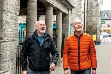  ??  ?? Local historians Alan Nicholls (left) and Peter Ford walk along Hay’s ancient streets lined with bookshops.