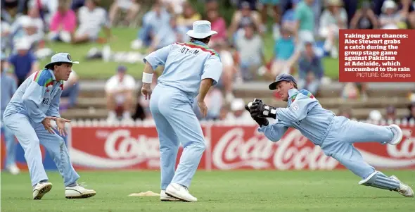  ?? PICTURE: Getty Images ?? Taking your chances: Alec Stewart grabs a catch during the group stage game against Pakistan at Adelaide, which succumbed to the rain