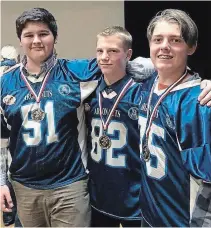  ?? SUBMITTED PHOTO ?? Among the senior division players honoured were, from left, Defensive Player of the Year Charlie Matthews, MVP Devon Johnson and Defensive Lineman Andy Hatton.