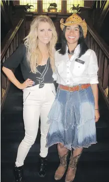  ??  ?? Pictured at Field Law’s Stampede party are headline entertaine­r Lindsay Ell, left, and Field Law’s Erika Carrasco.