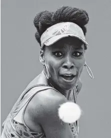  ?? THE ASSOCIATED PRESS ?? Venus Williams returns a shot from Viktoria Kuzmova during the first round of the U.S. Open tennis tournament Monday in New York.