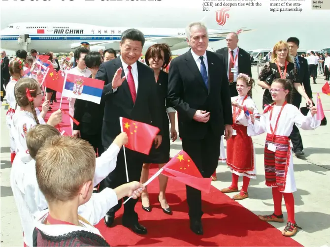  ??  ?? Chinese President Xi Jinping (center left) is welcomed by children as he walks with his Serbian counterpar­t, Tomislav Nikolic, after arriving in Belgrade, Serbia on Friday. From Serbia, Xi will visit Poland and Uzbekistan.