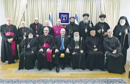  ?? (Mark Neyman/GPO) ?? PRESIDENT REUVEN RIVLIN poses with Christian leaders he hosted at the annual pre-New Year reception at his official residence in Jerusalem yesterday.