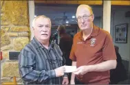  ?? Photo submitted ?? Bill Puskas (left), president of the Bella Vista Courtesy Van Program, accepts a donation from Darrell Bottjen, treasurer of the First United Methodist Church of Bella Vista’s United Methodist Men’s group. The Courtesy Van is one of 18 charities the UMM sponsors each year though fundraisin­g efforts of its members. Puskas was invited to the monthly meeting to update everyone on the mission, needs and availabili­ty of the program to Bella Vista residents. The Courtesy Van is a free service to those who lack transporta­tion and need rides in the local area.