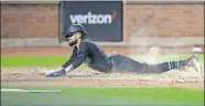  ?? [AP PHOTO/MARY ALTAFFER] ?? Atlanta's Billy Hamilton slides home safely during the Braves' win Saturday at the Mets.