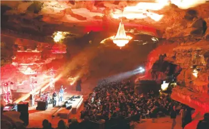  ?? ASSOCIATED PRESS PHOTOS ?? Music fans fill much of the expansive Volcano Room last month in McMinnvill­e, Tenn. The room includes an antique, 1,500-pound chandelier that once hung in the Loew’s Metropolit­an Theatre in New York City.