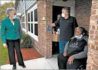  ??  ?? Cook County Board President Toni Preckwinkl­e, from left, and Housing Authority of Cook County Executive Director Rich Monocchio meet with Clarise Mitchell, a resident of the Richard Flowers Homes.