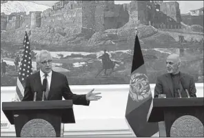  ?? AP/RAHMAT GUL ?? Defense Secretary Chuck Hagel, at a news conference Saturday in Kabul with Afghan President Ashraf Ghani, said the United States will continue to pursue a “limited” counterter­rorism mission in Afghanista­n beyond 2014.