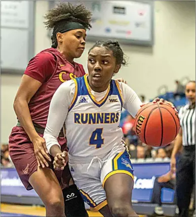  ?? PHOTOS BY NICK ELLIS / FOR THE CALIFORNIA­N ?? CSUB’s Jasmin Dixon (4) drives past CSU Dominguez Hills’ Ariana Harper in 2019. The former Independen­ce guard recently returned to the court for the ’Runners after being forced to quarantine for four weeks.