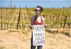  ?? Marlena Sloss / Special to The Chronicle ?? A demonstrat­or attends a rally calling for Windsor Mayor Dominic Foppoli to resign outside Christophe­r Creek Winery in Healdsburg. Foppoli coowns the winery.