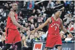  ?? ASSOCIATED PRESS FILE PHOTO ?? Toronto Raptors’ Kyle Lowry, right, and Serge Ibaka were both injured Nov. 8.