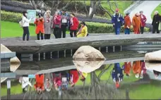  ?? YANG BO / FOR CHINA DAILY ?? Senior tourists visit a scenic spot in Hangzhou, Zhejiang province. Middle-aged and elderly consumers are expected to spend more than $109 billion on travel this year.