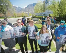  ?? RICK BOWMER/AP 2016 ?? Protesters at Brigham Young University in Provo, Utah, stand for rape victims. Proposed federal rules would widen colleges’ responsibi­lities on sexual misconduct.